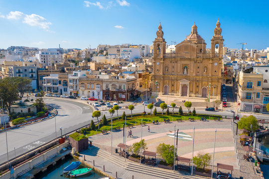 Aerial view of Msida marina bay and church. Sunny day. Malta island