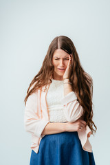 on a gray background young girl crying
