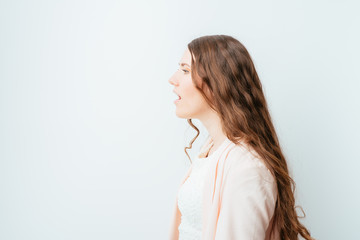 on a gray background young girl in profile