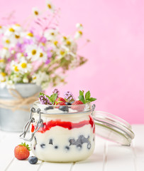 dessert in a jar on pink background