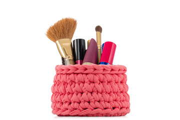 women cosmetics in a knitted purse