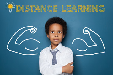Distance learning concept with clever black kid on blackboard background