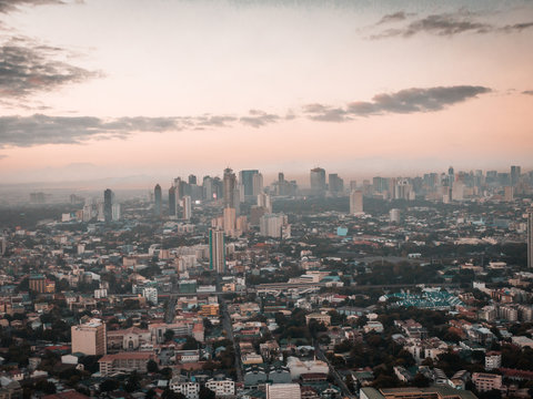 Aerial Cityscape of Quezon City in Metro Manila, Philippines while sunrise