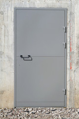 Gray concrete new  wall and  armored  steel  door