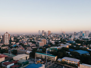 Obraz premium Aerial Cityscape of Metro Manila in the Philippines while sunrise