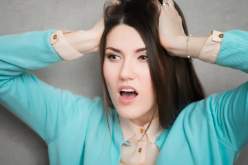 woman shocked anger. isolated on gray background