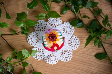 Easter egg made of paper, on a beautiful white napkin – decoration of a holiday table during celebration