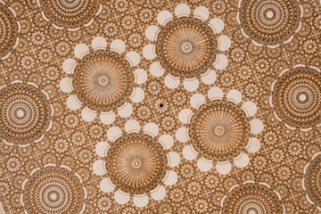 Fototapeta na wymiar Beautiful ceiling with carved plaster decoration.