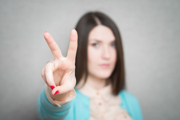girl showing two fingers