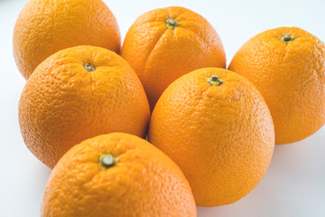 fresh oranges on a white background close up