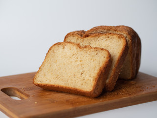 Fresh bread sliced on a wooden board. Homemade bread.