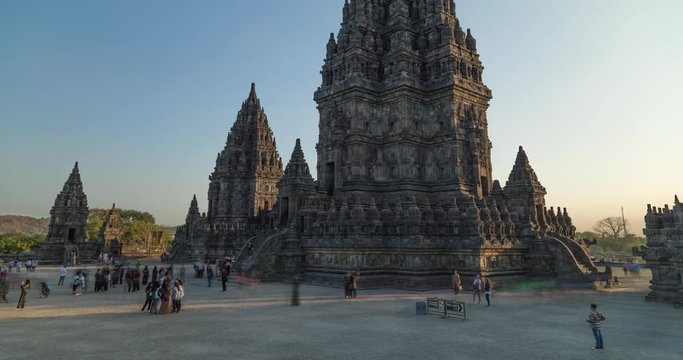 Prambanan, Indonesia - July 17, 2019: Timelapse from the people and tourists visiting the ancient temple of Prambanan close to Yogyakarta, in Central Java, Indonesia, photographed in the afternoon.