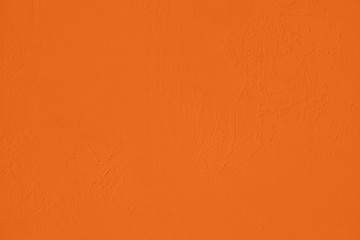 Saturated orange colored low contrast Concrete textured background with roughness and...