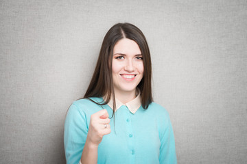 attractive woman showing fig gesture isolated