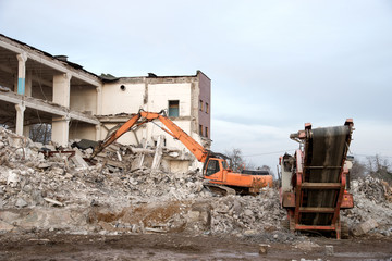 High Reach Excavator machines for demolition of tall building. Machine with hydraulic shears for...