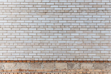 The wall is made of gray silicate bricks. Brickwork on the construction site of the house. Abstract construction texture.