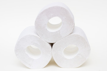 Stack of toilet paper rolls on white background