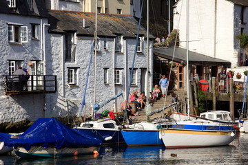 Fototapeta na wymiar Polperro (England), UK - August 16, 2015: Polperro harbour and village, Cornwall, England, United Kingdom. .