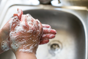 Fototapeta premium Washing hands with soap. prevent the spread of coronavirus.