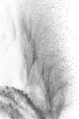 Black particles explosion isolated on white background.  Abstract dust overlay texture.