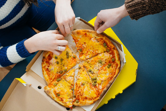 boy and girl share a pizza