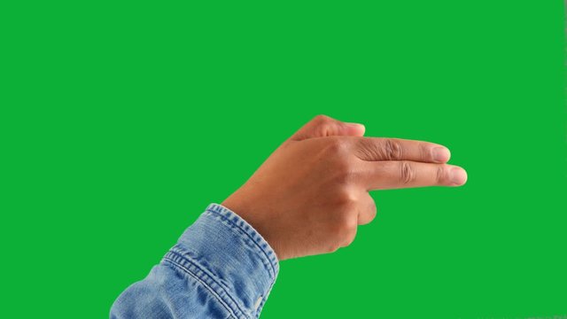 male hand do a gun gesture on green chromakey one click keying