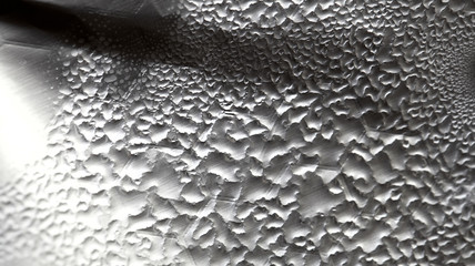 Water Drops On Foil Grey White Background, Texture colorful water drop. Abstract detail of moisture condensation problems, hot water vapor condensed on foil close up