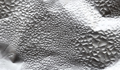 Water Drops On Foil Grey White Background, Texture colorful water drop. Abstract detail of moisture condensation problems, hot water vapor condensed on foil close up