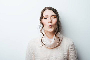 young girl  with kissing gesture