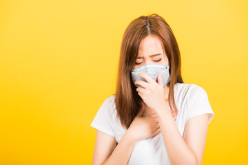 woman teen standing cough in mask protection from virus epidemic or air pollution