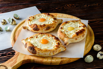 khachapuri with cheese and quail egg