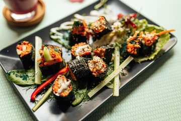 Raw vegan nori hand rolls close up view