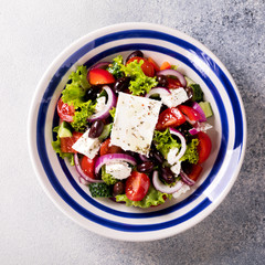 Greek salad of fresh vegetables, olives and feta. Traditional Mediterranean food.