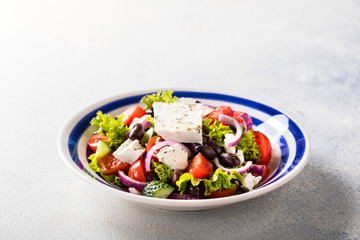 Greek salad of fresh vegetables, olives and feta. Traditional Mediterranean food.