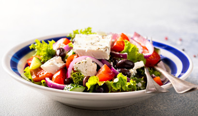 Greek salad of fresh vegetables, olives and feta. Traditional Mediterranean food.
