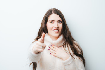 on a white background young girl with long hair raised his thumb up