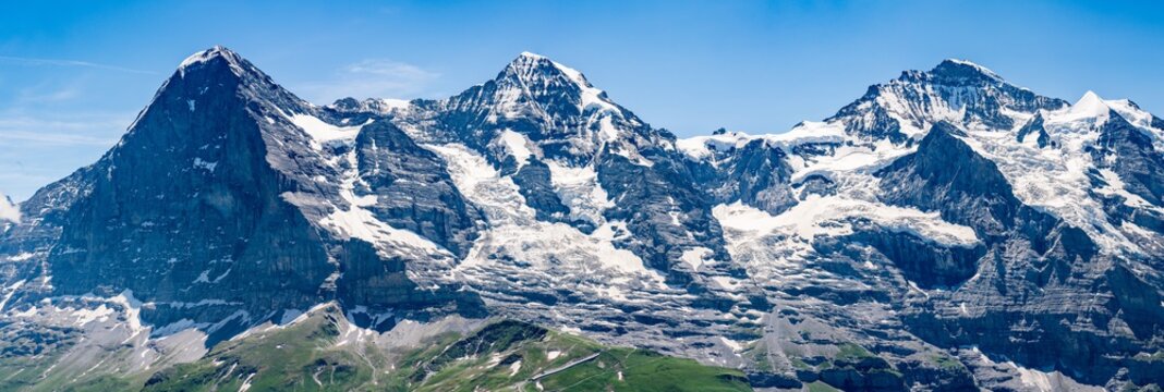 Switzerland, Panoramic view on Eiger, Monch and Jungfraujoch and green Alps around