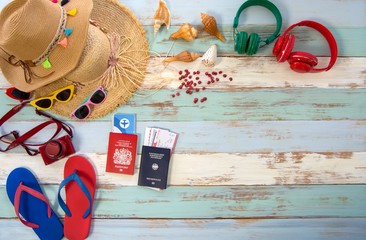 Summer traveler accessories, on wooden background with empty space for text. Travel vacation concept