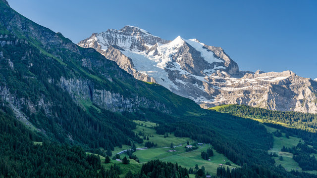 Switzerland, Panoramic view on Wengen and green Alps around