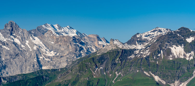 Switzerland, Panoramic view on Murren and green Alps around Mannlichen