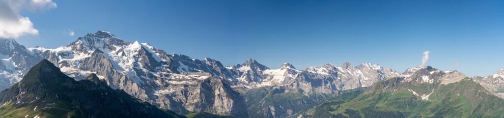 Fototapeta na wymiar Switzerland, Panoramic view on Murren and green Alps around