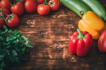 Healthy food. Vegetables and fruit. On a black wooden background. Top view. Space for copying.