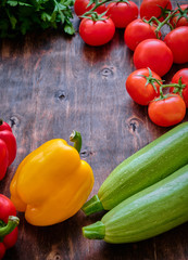 Healthy food. Vegetables and fruit. On a black wooden background. Top view. Space for copying.