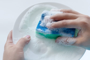 washing dishes, a plate in foam