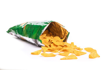 Heap of open packages and corn chips on a white background