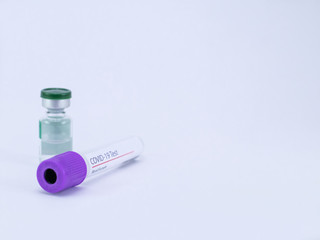High angle close up of a COVID 19 blood sample tube with vial shot on white background and copy space.