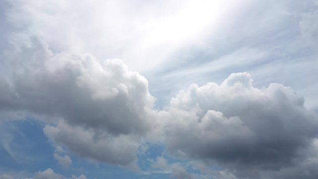 Building motions clouds. Puffy fluffy white clouds sky time lapse. Fluffy cloudscape environment climate change background. Abstract natural cloudy weather background. Cumulus cloud high heaven air. 