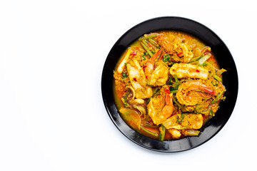 Fried seafood with curry powder on white