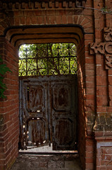 old metal door in the stone wall