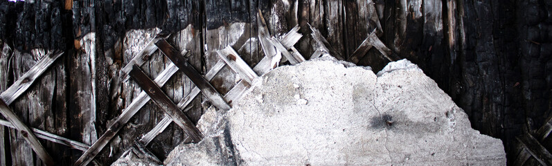 Texture of an old wooden plaster wall with a piece of plaster